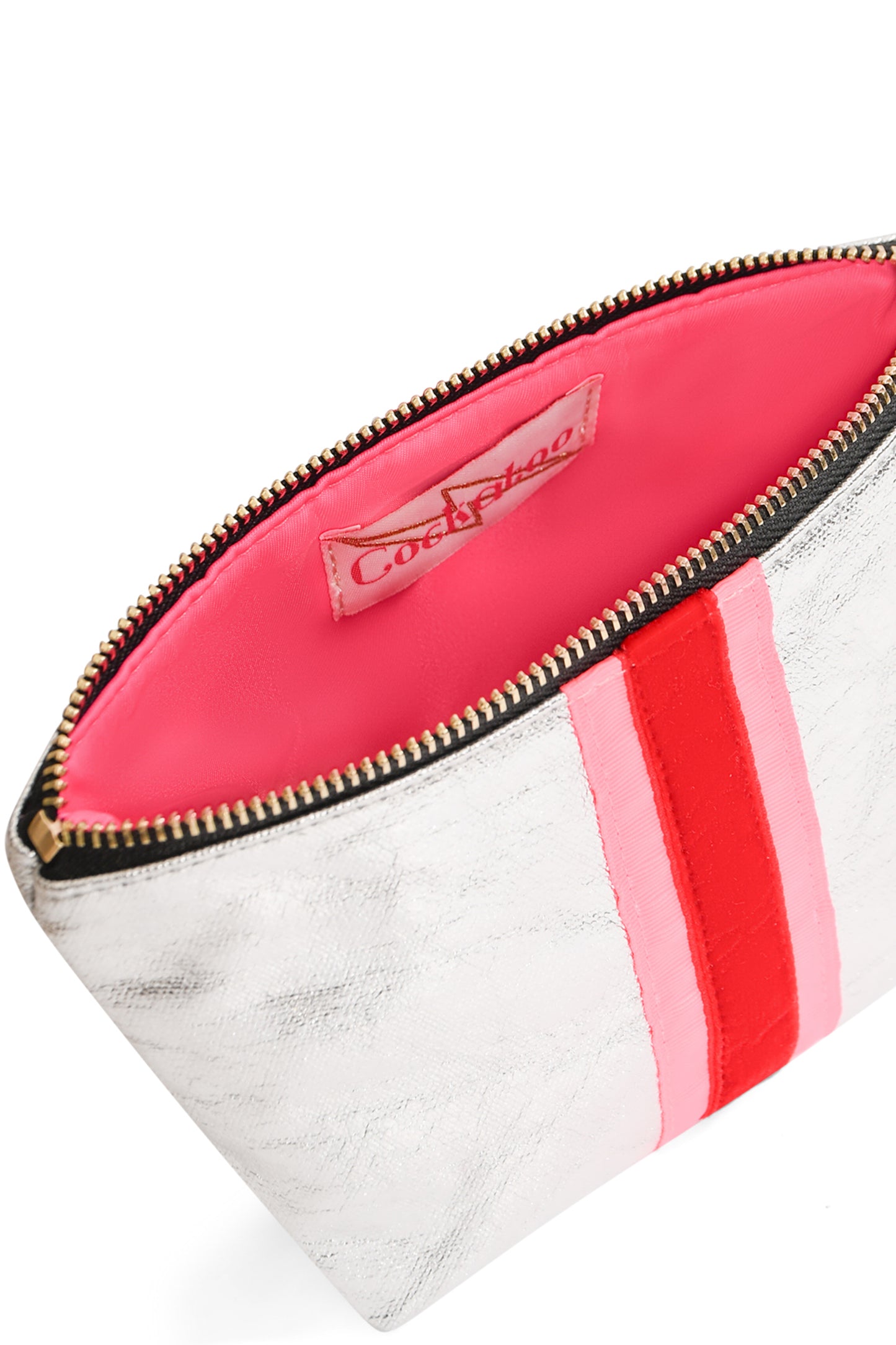 Close up of silver clutch bag showing red velvet stripe and hot pink water-resistant lining with gold zip