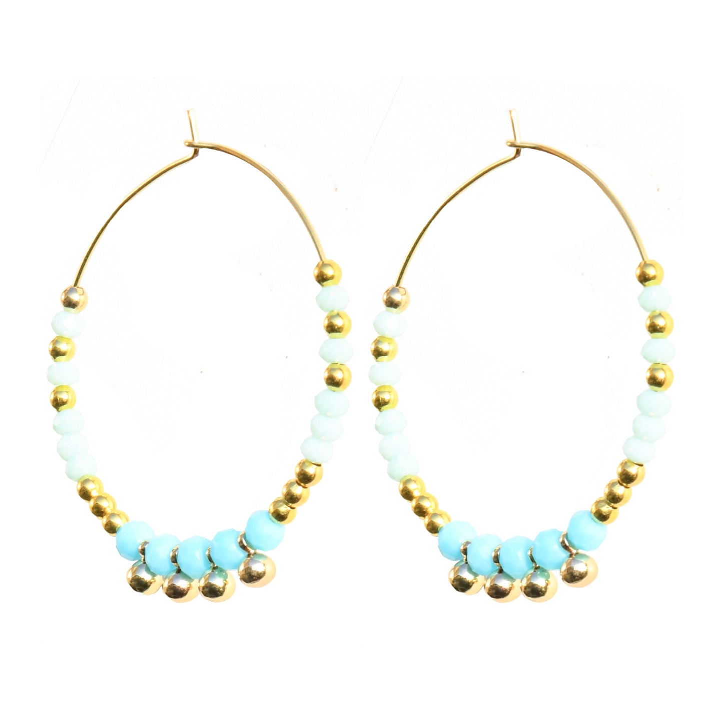 Pair of hoop earrings with turquoise beads and gold accents on a white background