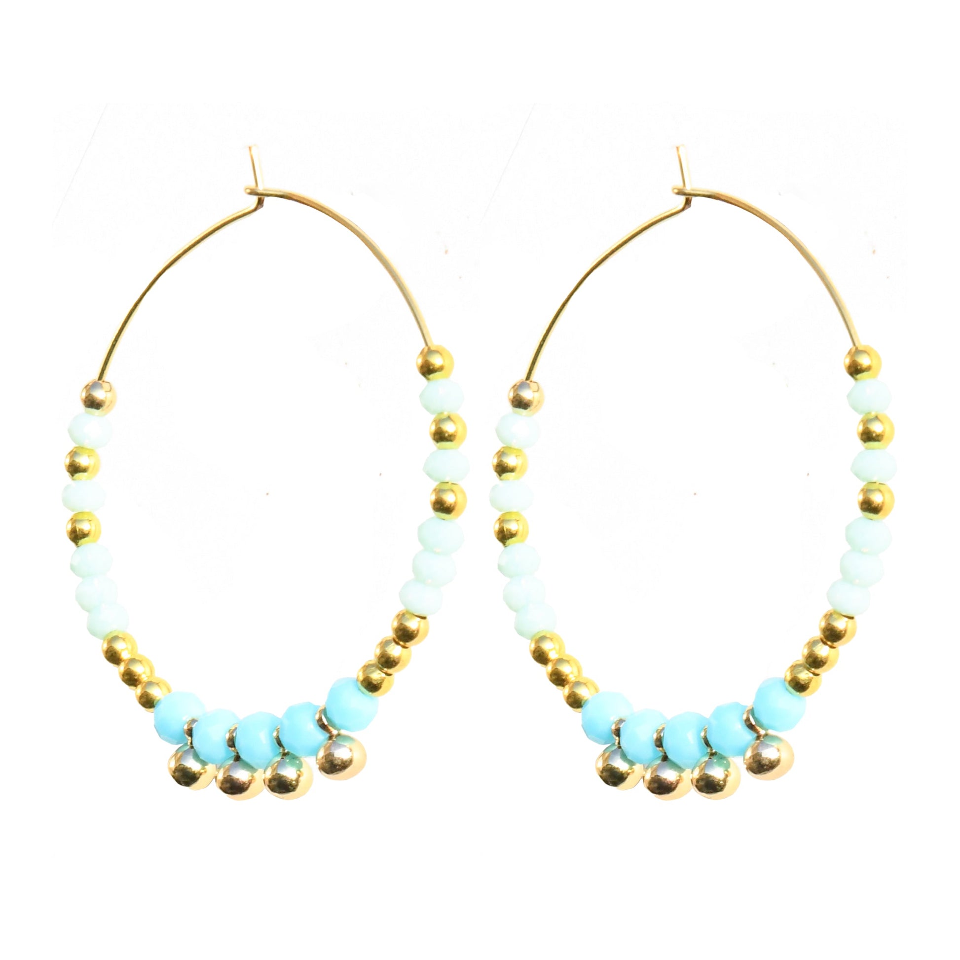 Pair of hoop earrings with turquoise beads and gold accents on a white background
