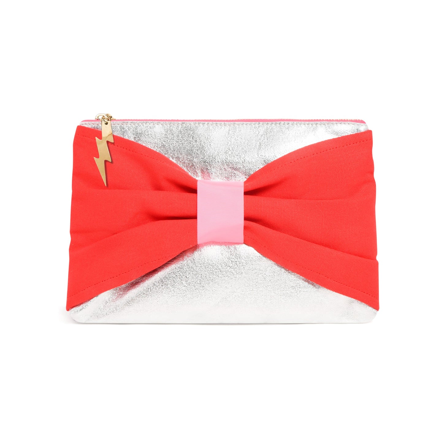 A metallic silver clutch bag featuring a large red fabric bow across the front with a light pink center band and a small gold lightning bolt charm on the zipper pull.