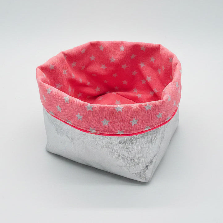 Pink fabric basket with white stars with reversible silver fabric 